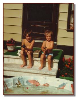 Andy (right) and Rod Jr. practicing fishing in a backyard pool